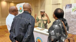 SACHIDA exhibition stand in Botswana explaining to attendees.